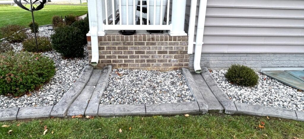 Decorative concrete landscape edging around front yard in Fredericksburg VA