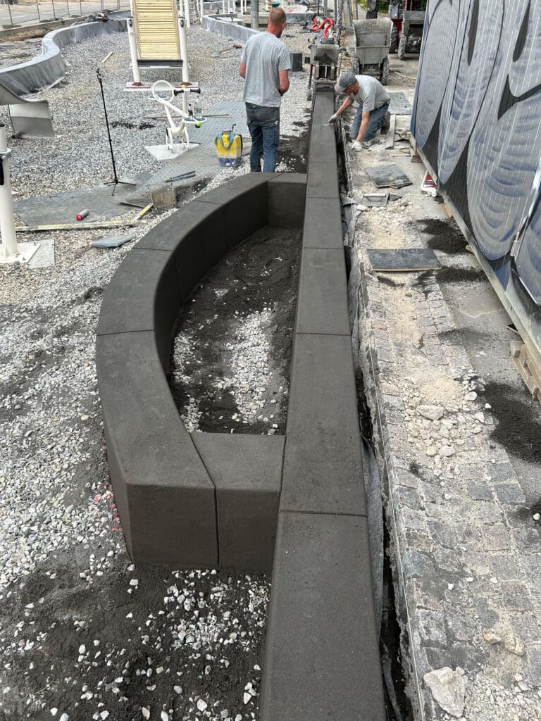 Concrete curb planter edging installation for commercial landscape